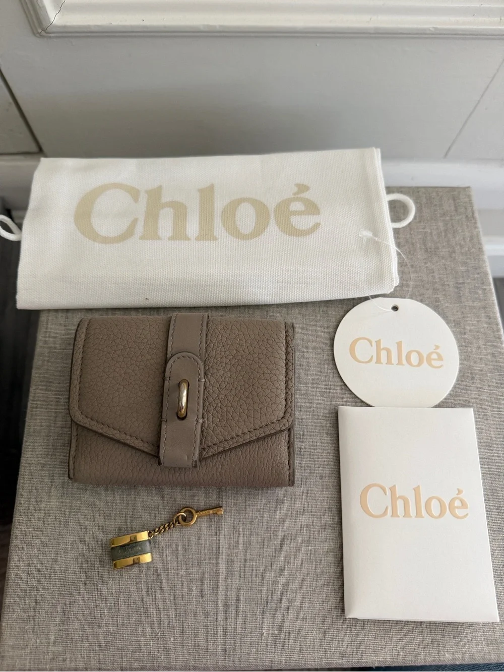 Chloé Pebbled Leather Trifold Wallet in Taupe